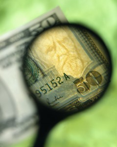 Magnifying Glass and U.S. Fifty Dollar Bill